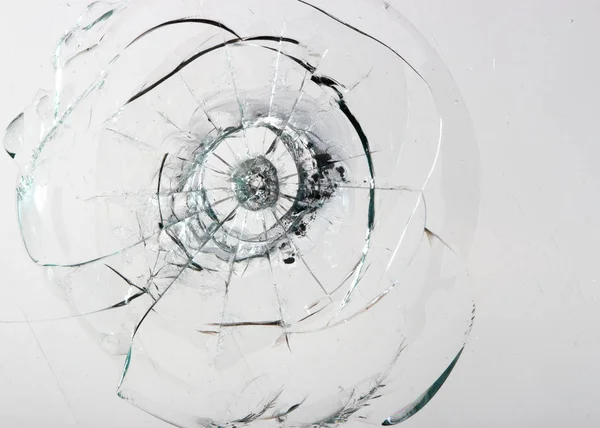 Cracked glass on a white background texture