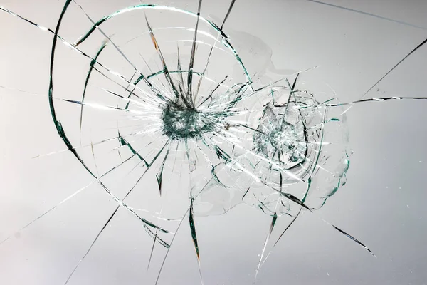 Cracked glass on a white background texture