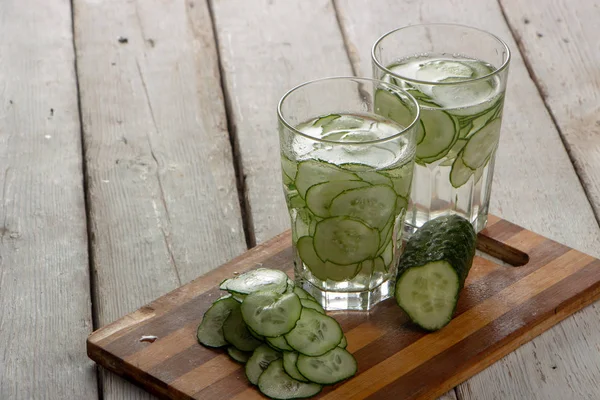 Cucumber water, cleansing water to detoxify the body and quench thirst on a white background.