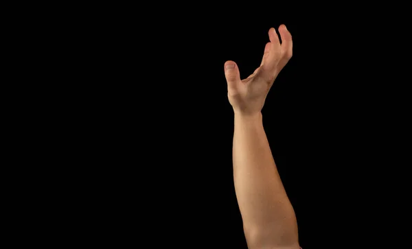 The hand of a young man on a black background — Stock Photo, Image