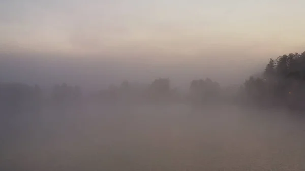 Drone wiev Orange dawn over foggy lake. the sky is well reflected in the water — Stock Photo, Image