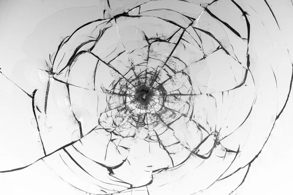 Cracked glass on a white background texture