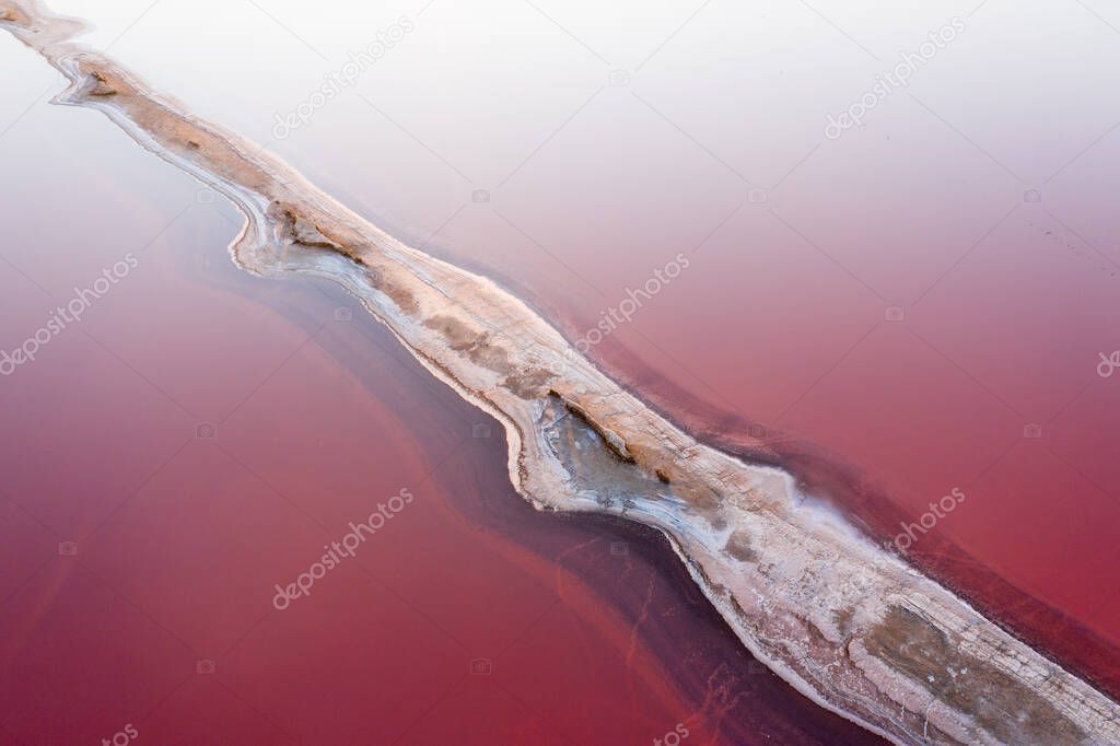 White salt on the shores of the island in Pink Island. Lake Lemuria, Ukraine.