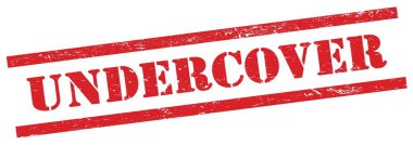 Kırmızı grungy dikdörtgen damgalı Undercover metni.