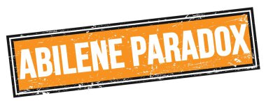 ABILENE PARADOX 'un turuncu siyah, kirli dikdörtgen damgalı metni.