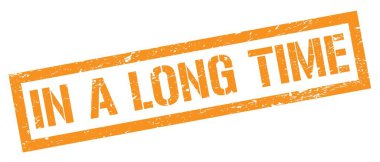 Uzun bir süre turuncu, kirli, dikdörtgen damgalı bir levhada.