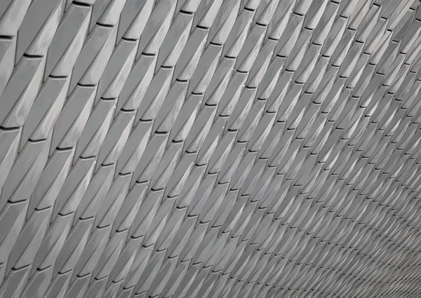 Grauer abstrakter Hintergrund mit Perspektive. die schuppigen Flocken des Musters. — Stockfoto