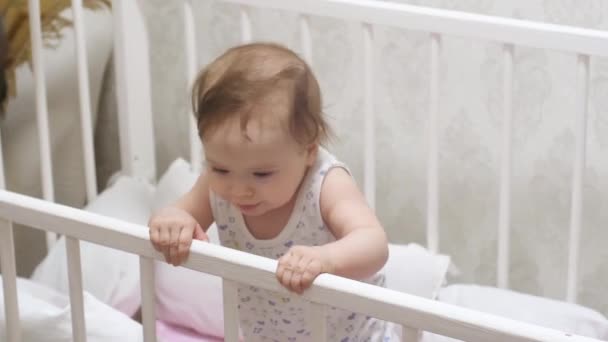 Baby smiles with first milk teeth. — Stock Video