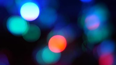 Arka plan ile renkli ışıklar yanar. Bokeh