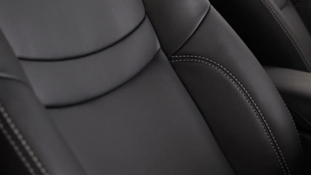 Black leather seat covers in the car. — Stock Video