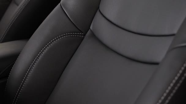 Black leather seat covers in the car. — Stock Video