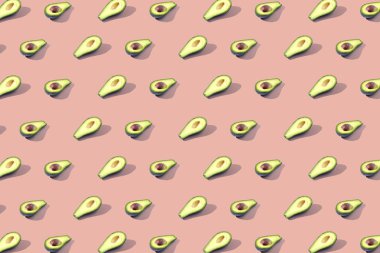 Birçok Yarım avokado, desen, afiş. Parlak arka plan, turuncu pembe pastel renk hasat.