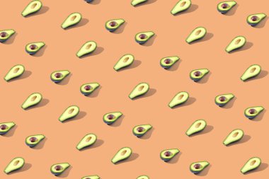 Birçok Yarım avokado, desen, afiş. Parlak arka plan, turuncu pembe pastel renk hasat.