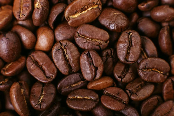 Aroma roasted coffee beans, brown background. Soft focus close up.