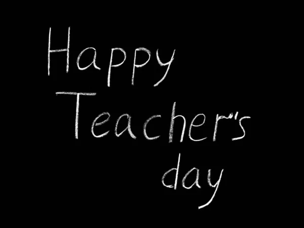 Happy Teacher\'s day - white inscription on a black board, handdrawn typography poster. Vector illustration.