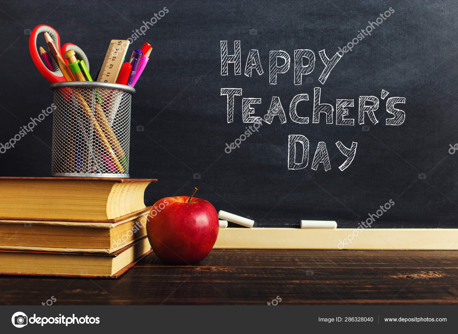 Teacher S Desk With Writing Materials A Book And An Apple A