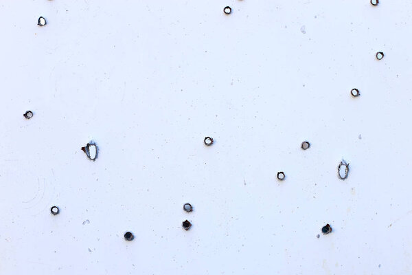 Дорожный знак села, на месте боевых действий. Пулевые отверстия в металле
.