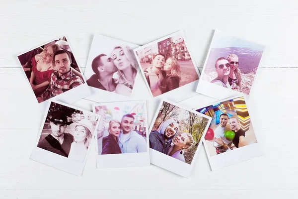 Printed photos in a loving couple from different places. Pleasan — Stock Photo, Image