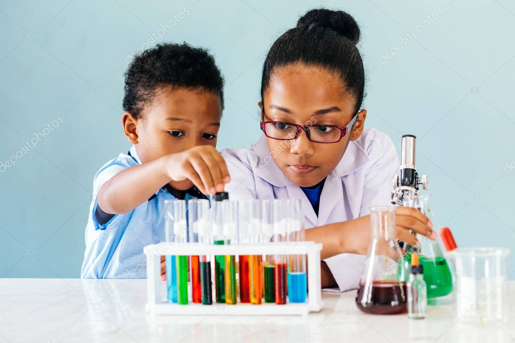 Black kids doing chemistry experiments