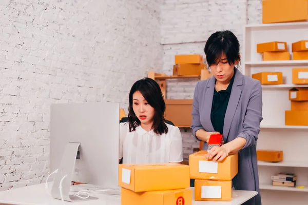 Happy Asian business women smiling in the office