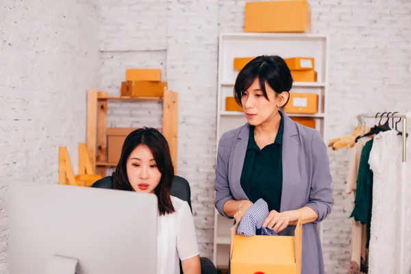 Happy Asian business women smiling in the office