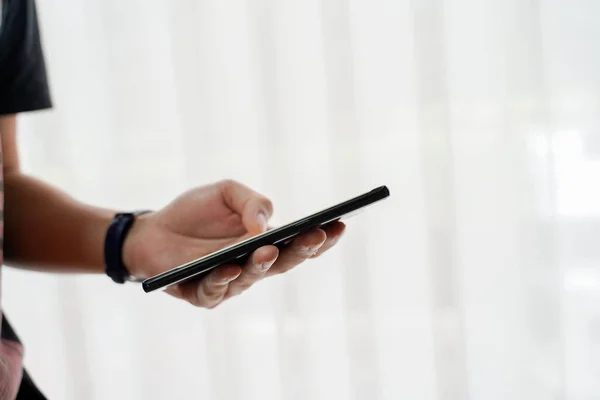 Person holding smartphone with touchscreen — Stock Photo, Image