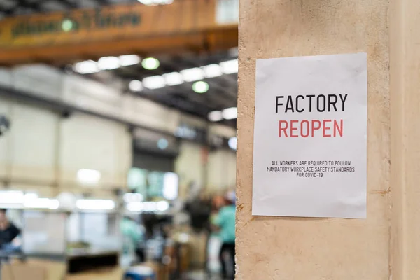 Factory Reopen sign inside the factory warehouse after shutting down affected by Coronavirus Covid-19