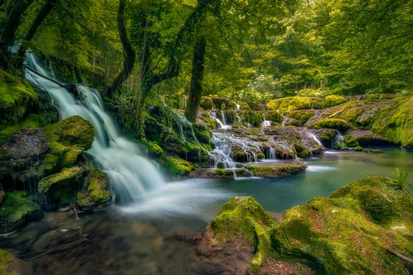 A big waterfall in deep forest in Nera Gorges Cheile Nerei in Romania