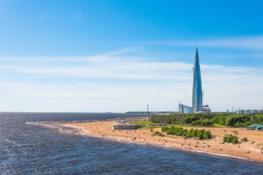 Skyscraper Lakhta Center on the coast of The beach Gulf of Finland. 03 June 2018 clipart