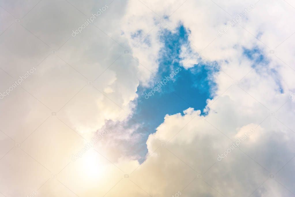 Divine light from the sun in a clear cloud and blue sky