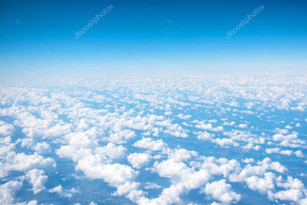 Beautiful beds of cumulus clouds on a warm summer day from the altitude of the aircraft