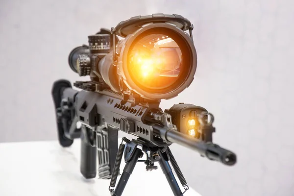 Rifle with a gun with a magnifying and infrared scope