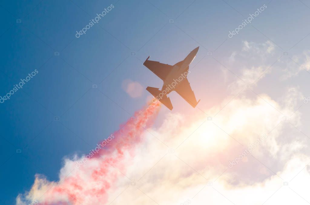 Fighter jet planes fly and leave behind a smoke trail, clouds sun glare