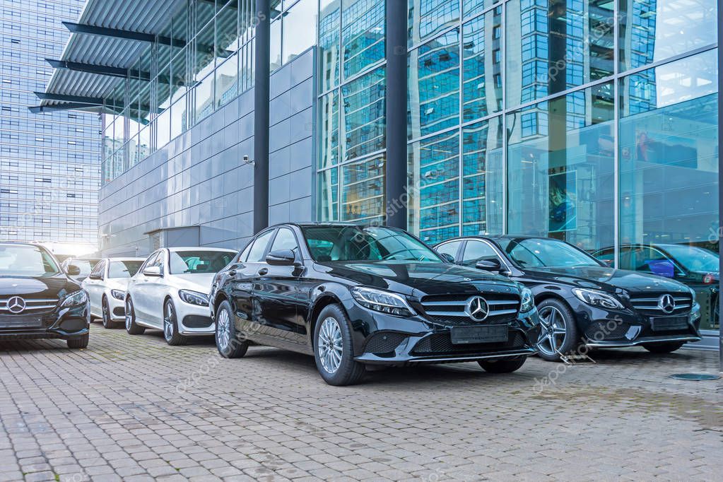 Luxury cars Mercedes-Benz C and E class parking in front of car store. Russia. Saint-Petersburg. 09 October 2018