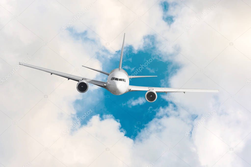 Passenger plane fly on a hight above clouds and blue sky