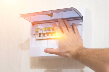 Protection of electrical installation setting the switchboard, switch on by hand- electric shock.