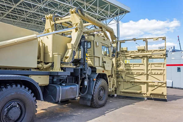 Powerful army truck for the soldiers with a shield to contain riot protection.