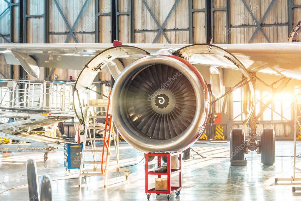 Industrial theme - repair and maintenance of aircraft, view of the airplane engine jet.