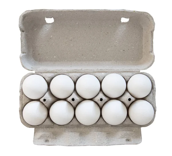 Десять білих курячих яєць в упаковці з відкритою кришкою. Ізольовані на білому тлі, вид зверху — стокове фото