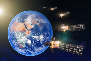 Group of satellites in a row in the geostationary orbit of the Earth, for communication and monitoring systems. Elements of this image furnished by NASA. clipart