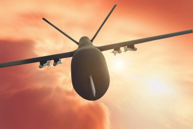 Askeri drone uçuş Hareket Bulanıklığı kırmızı günbatımı arka plan üzerinde. Görünümü kapatın.