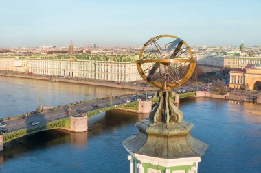 The upper part of the Kunstkamera building with an armillary sphere. View of the Neva River, View of the Palace Bridge, the Hermitage Winter Palace. Evening, sunset at the golden hour. clipart