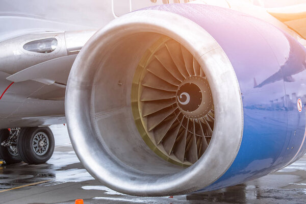 View of the engine of the aircraft blade and landing gear.