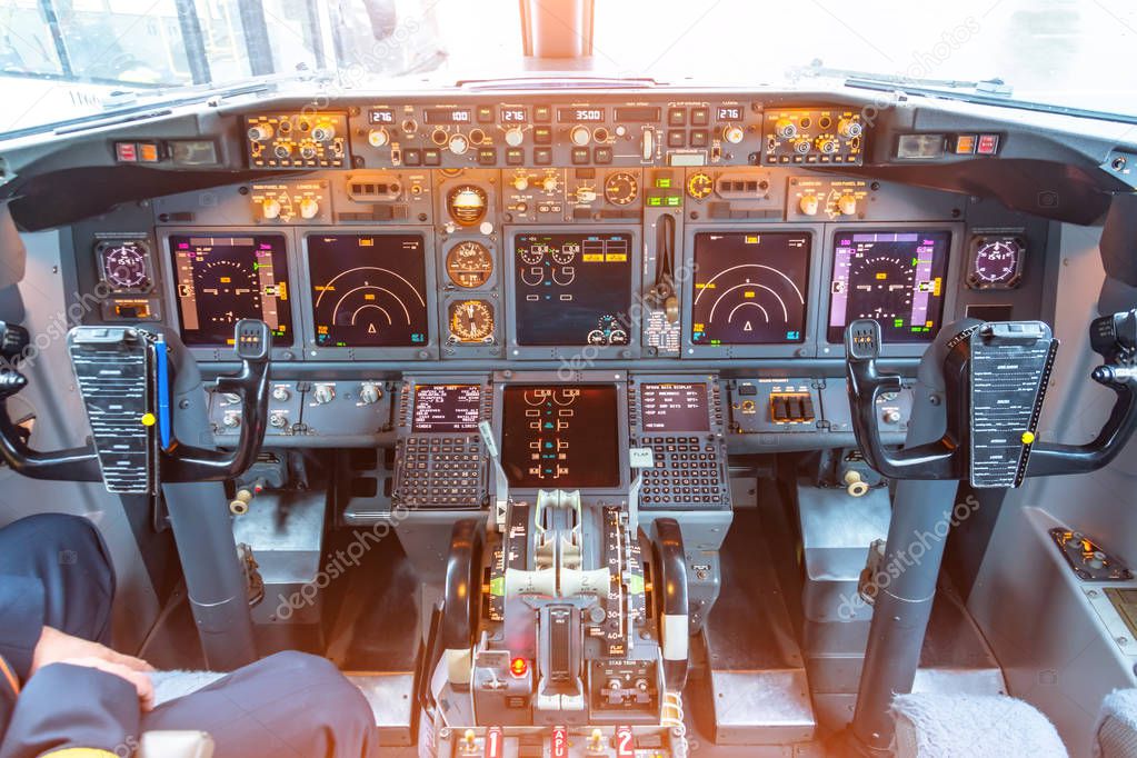 Cockpit in the plane, view of the control panel and steering wheels.