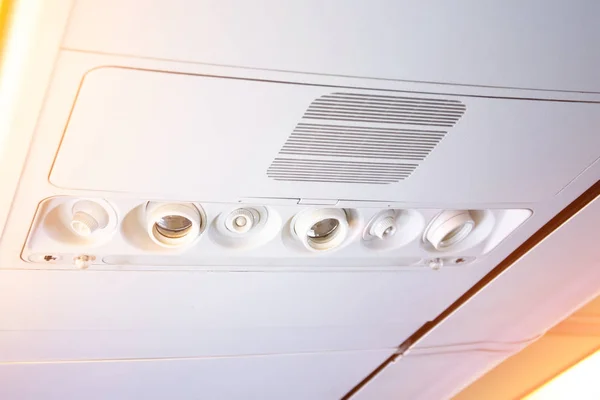 Overhead console in the modern passenger aircraft. air conditioner button and lighting switch, flight attendant call buttons. — Stock Photo, Image