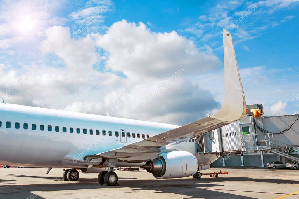 Passenger aircraft parked at the terminal, flight service.