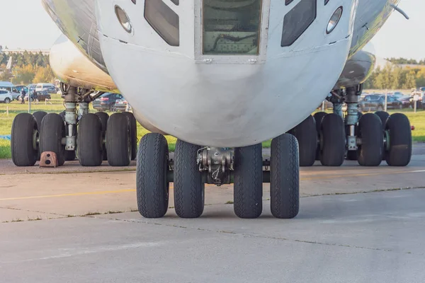 View of the front landing gear in the background rear rack chassis wheels.