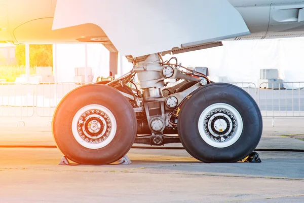 Aircraft rear landing gear with wheels and rubber, side view. — Stock Photo, Image