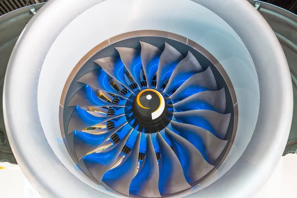 Turbo jet engine of the plane, close up in the blue light from t