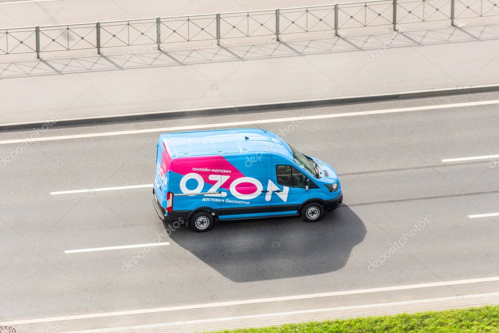 Mini van truck for delivery to points of delivery of the online store Ozon.ru rushing rides highway city road. Russia, Saint-Petersburg. 05 september 2020